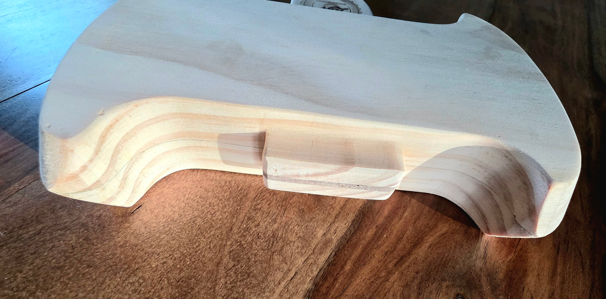 Toy handmade wooden axe showing detail of the axe head