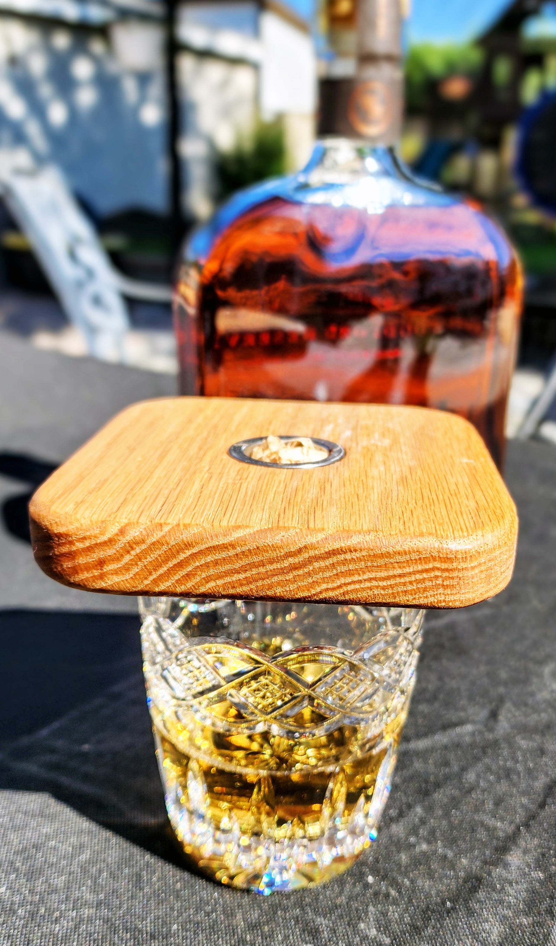 Handcrafted wooden cocktail smoker on whiskey glass