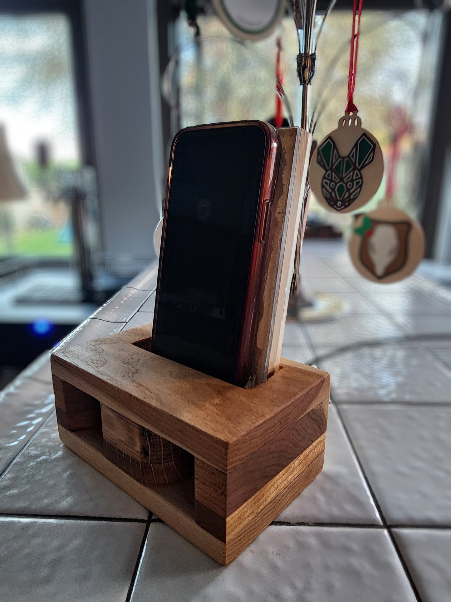 Wireless phone charger and acoustic amplifier.