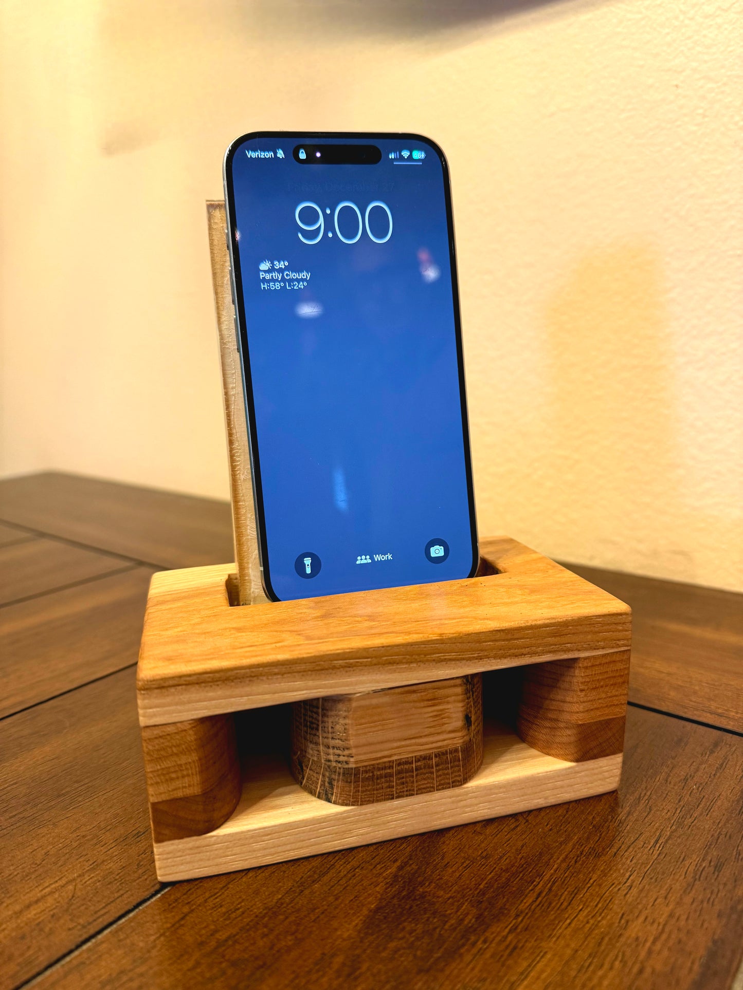 Wireless phone charger and acoustic amplifier.